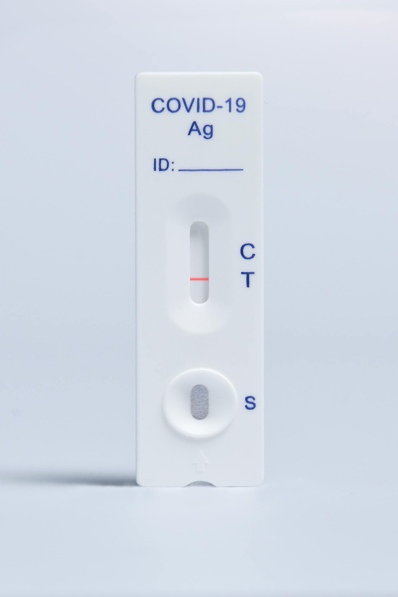 Detailed image of a COVID-19 rapid antigen test kit on a white background.